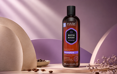Maple Holistics Biotin Shampoo for thinning hair displayed with peppermint leaves on a modern green product background
